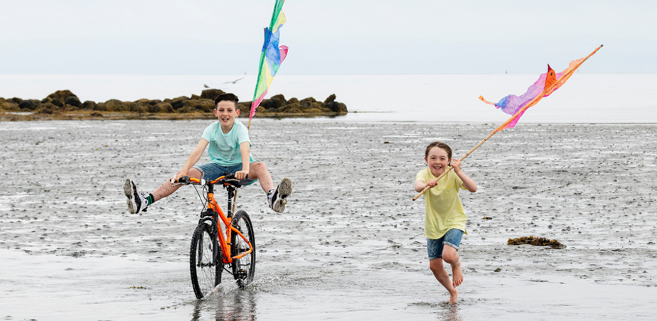 Baboró Arts Festival for Children - two kids on a beach flying flags