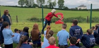 Image: An artist evaluating a problem-solving task with the teacher and students. St Killian’s in Mullagh Cavan. Photographer Vera McEvoy