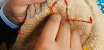 Student from Our Lady of Mercy Primary School, Sligo sewing TAP 2022.jpg