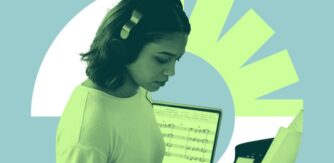 Image of student wearing headphone and using music technology for UCD Composition Prize