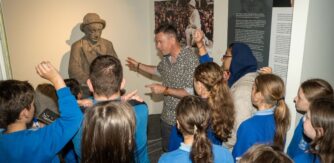 Brendan McGowan, Museum Education Officer sharing the story of Pádraic Ó Conaire with school children visiting the Galway City Museum